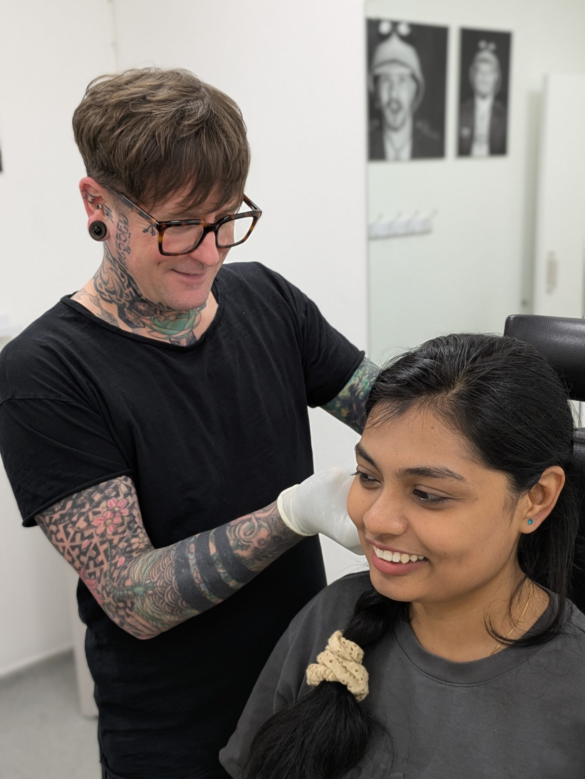 AJ piercing a happy customer at Metal Fatigue Bournemouth
