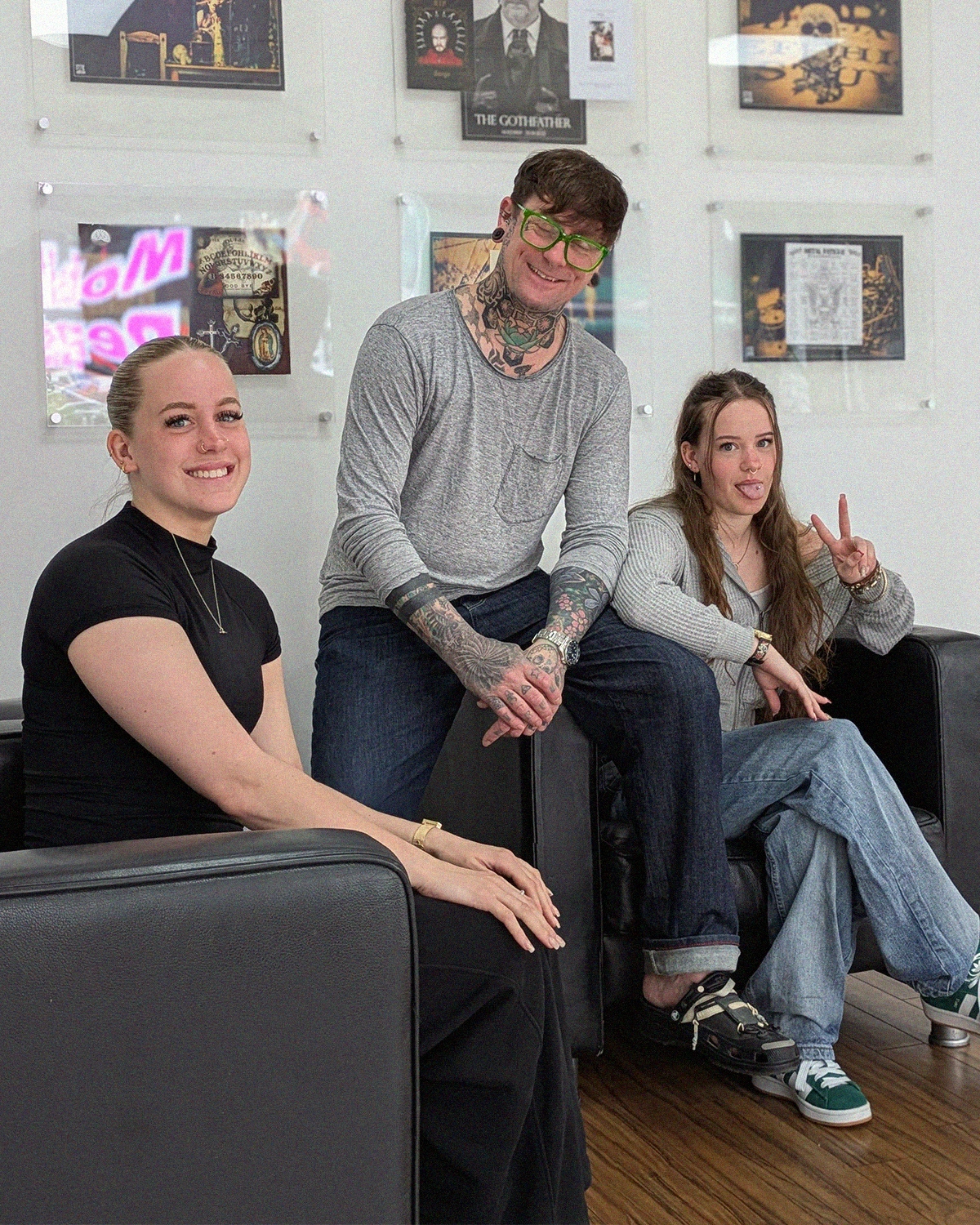 AJ the piercer with his daughters laughing in Metal Fatigue piercing studio in Bournemouth, Dorset