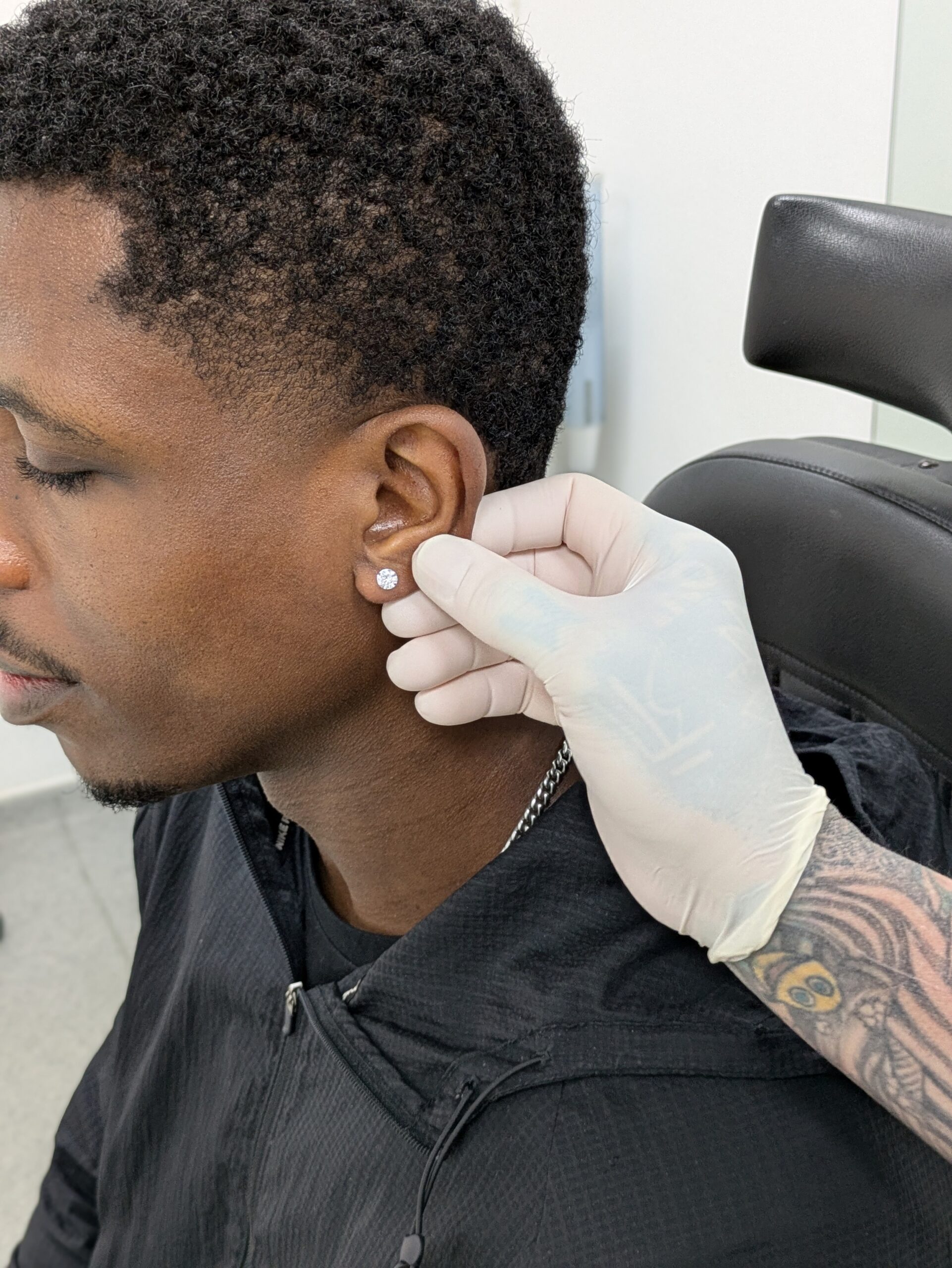 Fitting a new diamond earring at Metal Fatigue Piercing in Bournemouth